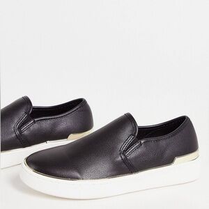 London Rebel slip on trainers with metal trim in black Size 8